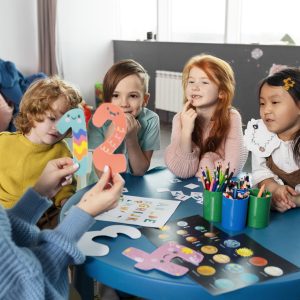 medium-shot-kids-sitting-together-table